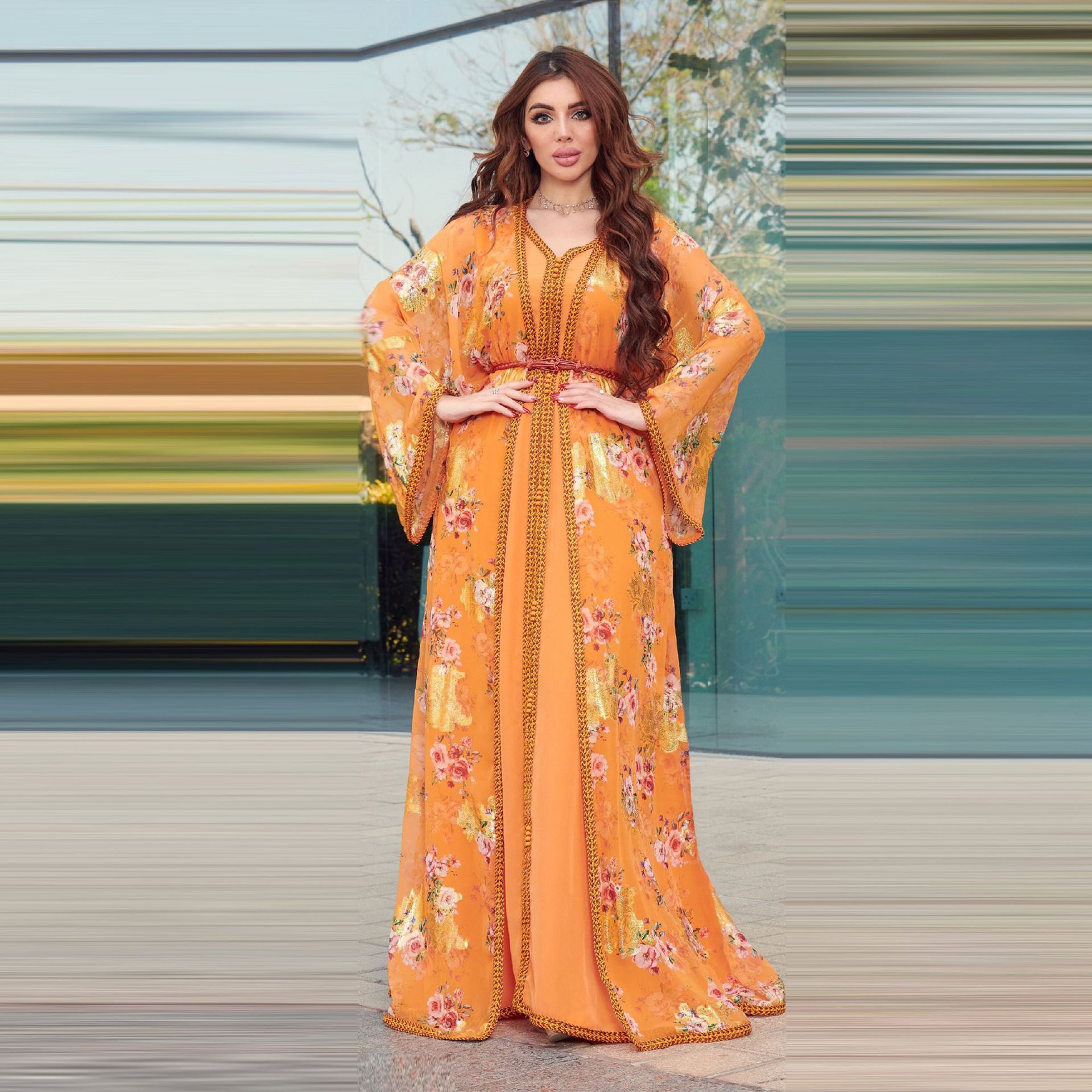 Jalabiya Experience the grandeur of a two-piece jalabiya set with delicate chiffon prints | exquisite gold foil accents | a captivating design aesthetic | and an atmosphere of elegance