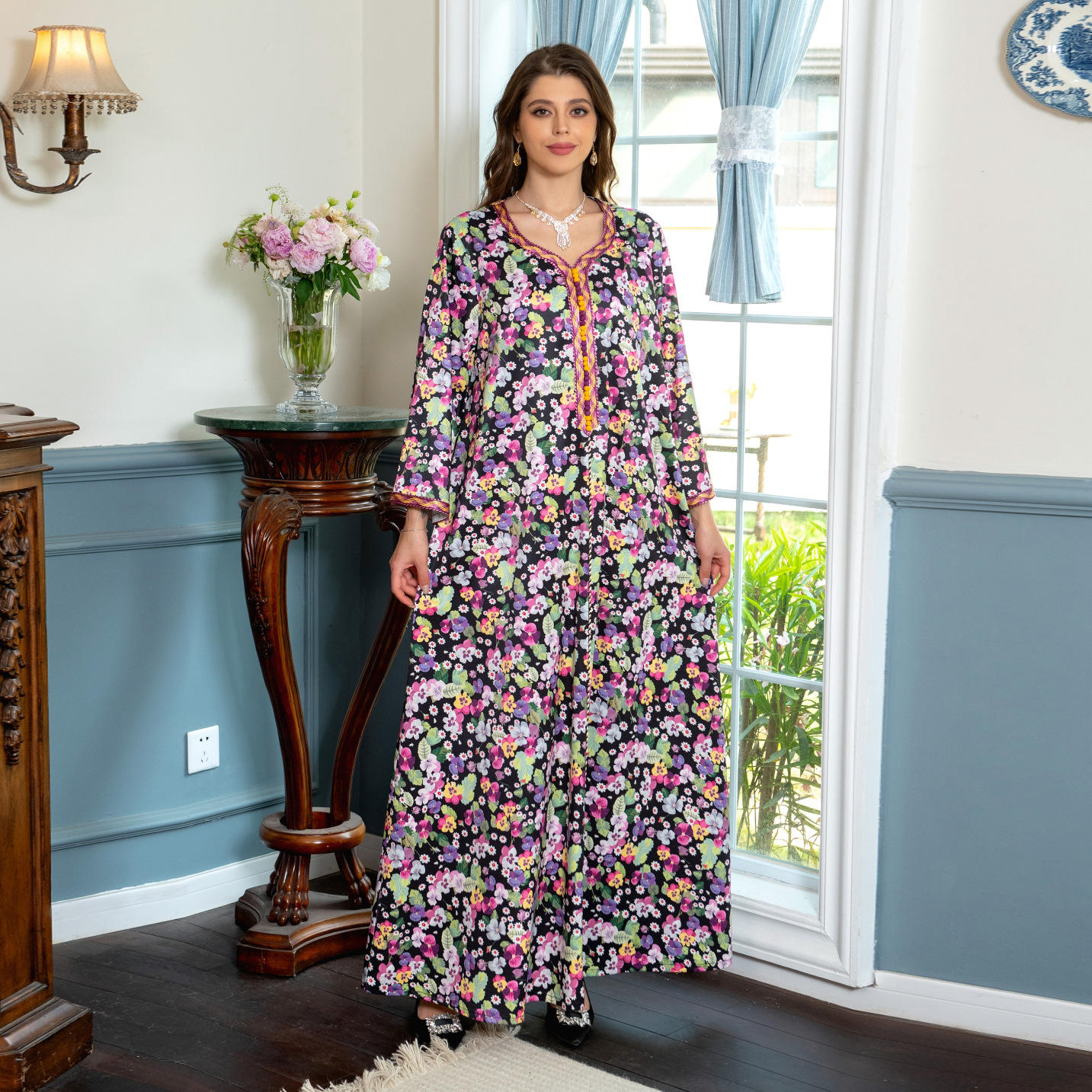 Jalabiya Experience the uniqueness of a floral-printed jalabiya | adorned with handwoven accents | providing a blend of softness | comfort | and distinctiveness
