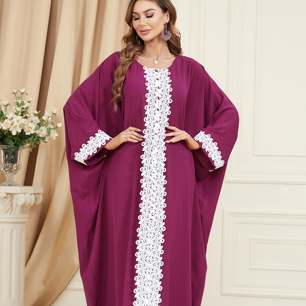 Jalabiya Experience the shimmering allure of a silky jalabiya | Exuding a sense of artistry | Featuring loose batwing sleeves | Intricate jacquard patchwork