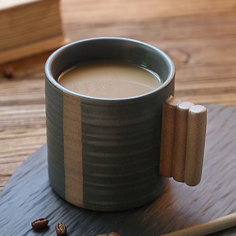Creative ceramic coffee cup with a unique handle inspired by the shape of a sugar-coated hawthorn. Featuring a rustic and textured finish in a Japanese-inspired design, this cup adds a touch of uniqueness to your coffee experience
