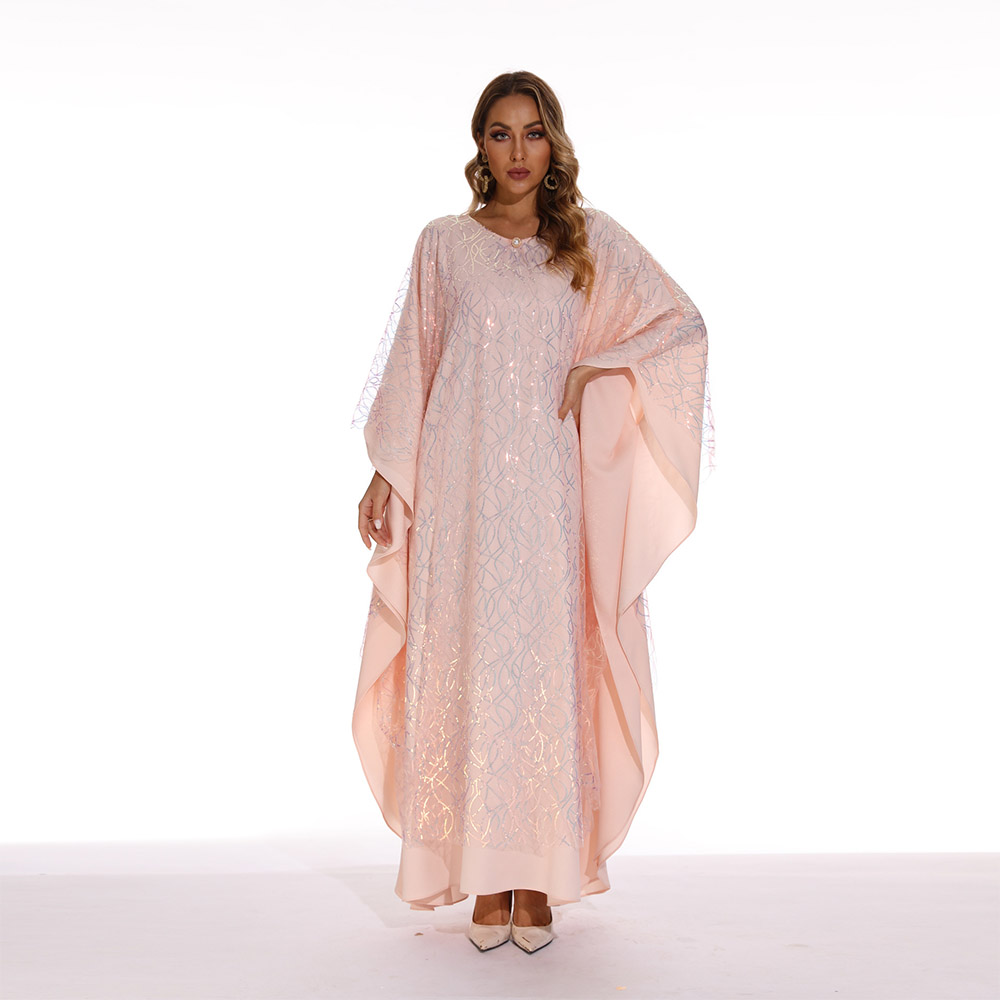 Muslim women's long dress with batwing sleeves, adorned with embroidered details and sparkling sequins, exuding an elegant and graceful charm