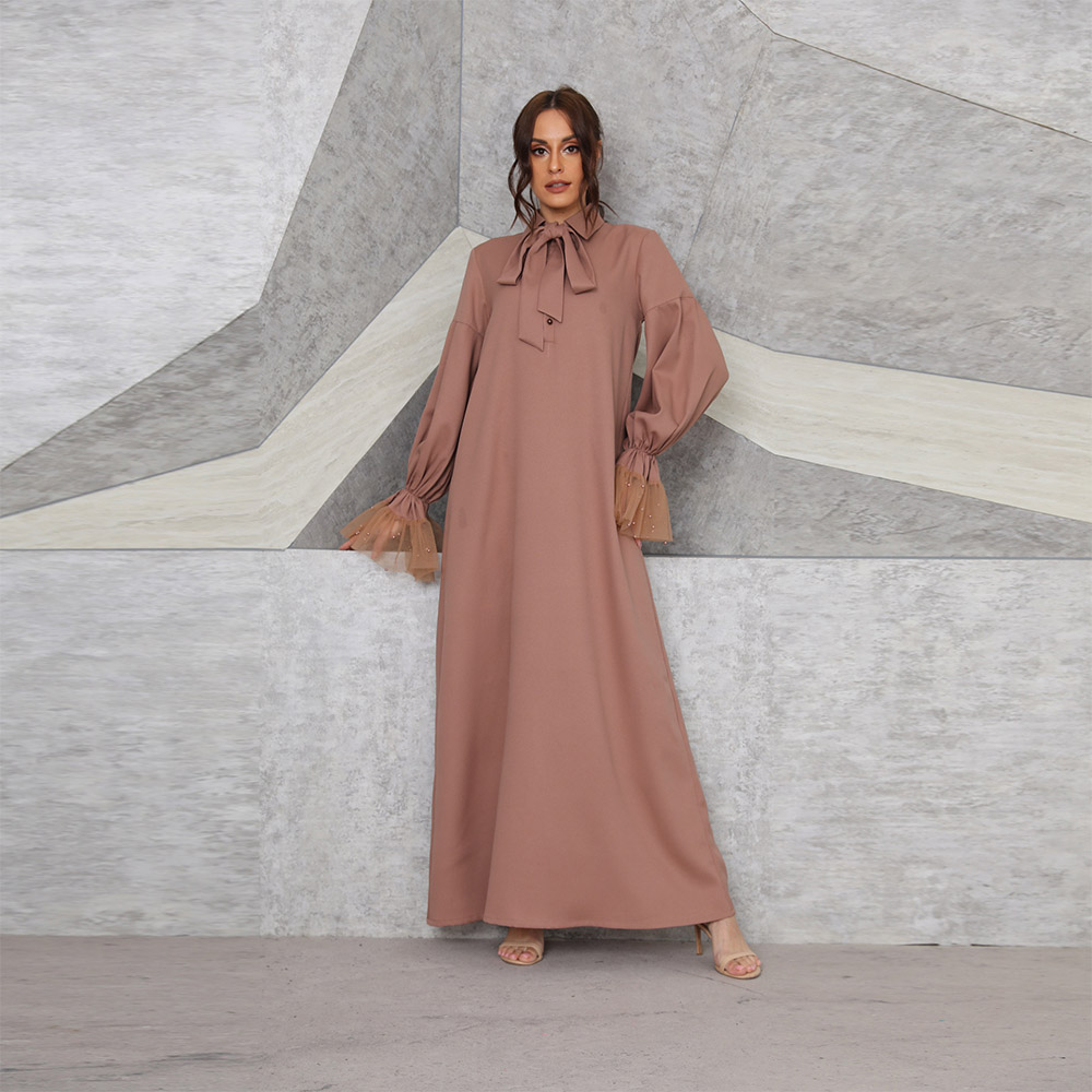 Muslim women's long brown dress with beaded mesh cuffs